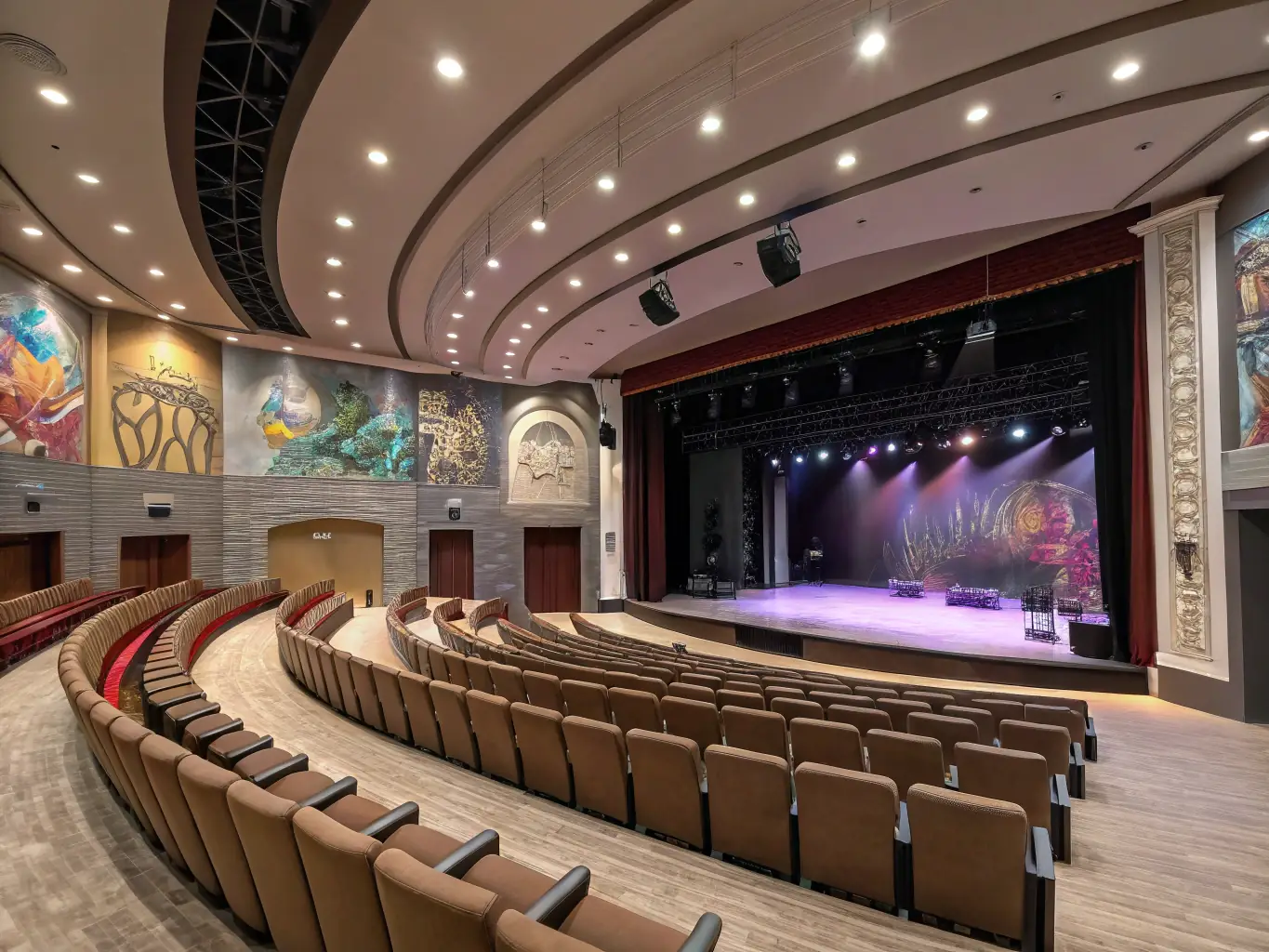 A photo of a modern concert hall or theater, showcasing its elegant architecture and inviting atmosphere. The image should highlight the venue's appeal and comfort.